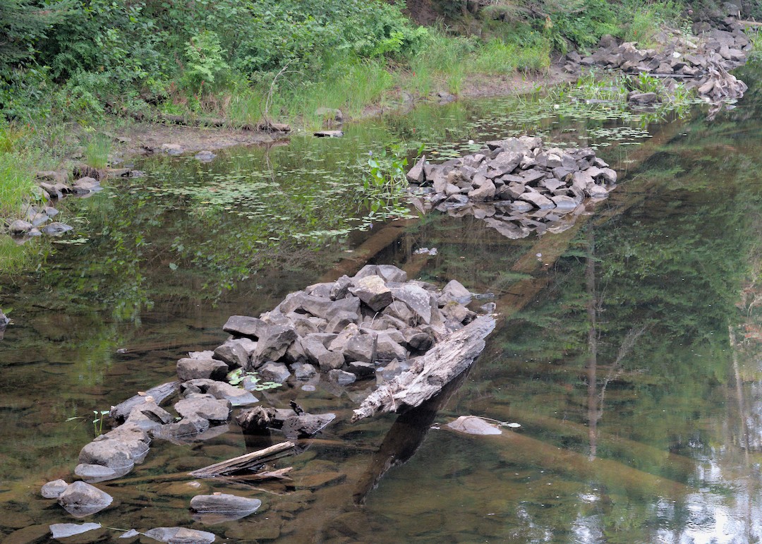3 rock piles in the river bed